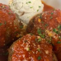 Momma'S Meatballs · Three Italian meatballs topped with tomato sauce, ricotta, and parmesan cheese.