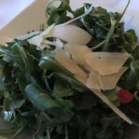 Arugula · Baby arugula, red onion, tomato, and parmigiana flurries with our house vinaigrette. Add gri...