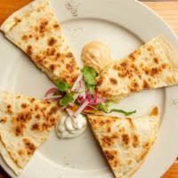 Cheese Quesadilla · Toasted flour tortilla filled with our signature mix of melted cheeses.