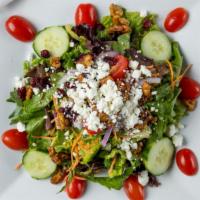 Signature · Mixed field greens, romaine, red onion, cucumber, cherry tomato, candied walnuts, dried cran...