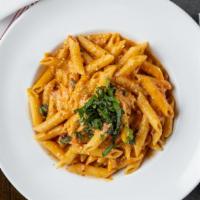 Penne Vodka · Penne tossed in our house-made vodka tomato cream sauce with pancetta.