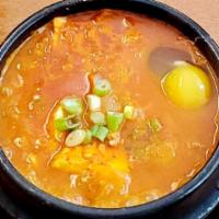 Kimchi Tofu Soup · kimchi flavored , rich collagen , pork  ,green onion