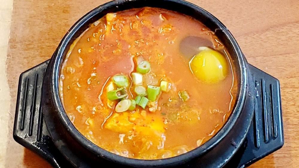 Kimchi Tofu Soup · kimchi flavored , rich collagen , pork  ,green onion