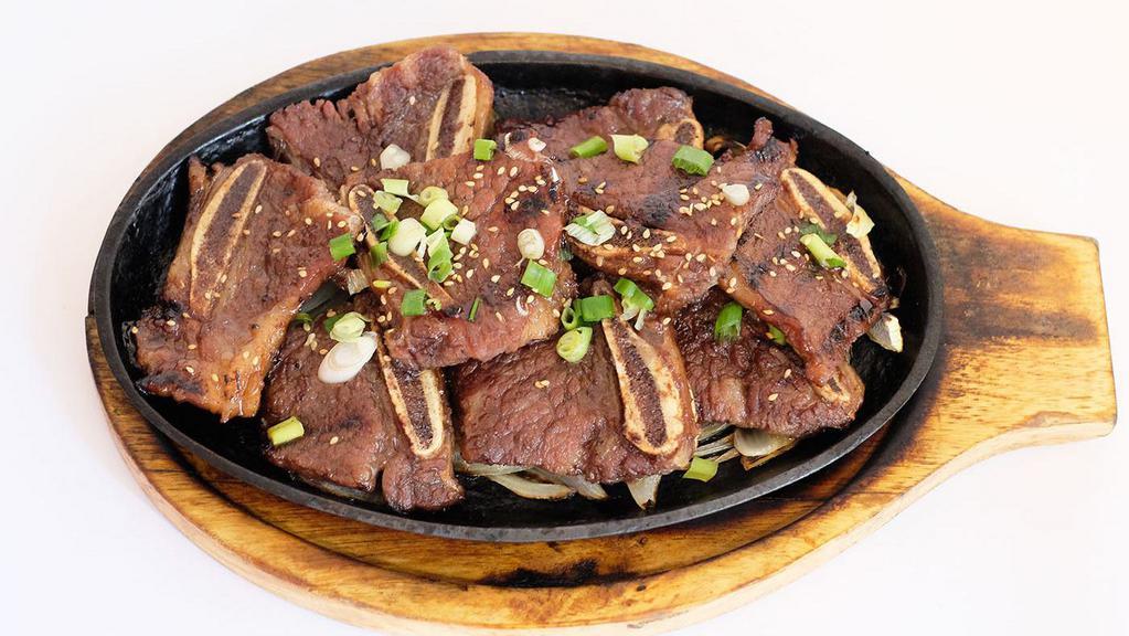 Kalbi · short rib  marinated special sauce , come rice with 4 kind of side dish