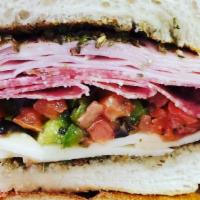 The Italian · Ham, salami, capicola, and provolone cheese with lettuce, tomatoes, mayo, and our homemade I...