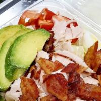 Cobb Salad · Mixed greens topped with roast turkey, bacon, avocado, hard boiled egg, cucumbers, and tomat...