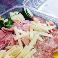 Antipasto · Mixed greens topped with ham, salami, provolone cheese, banana peppers, white onions, tomato...