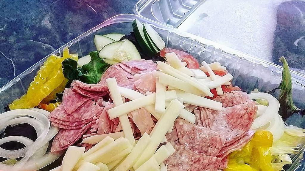 Antipasto · Mixed greens topped with ham, salami, provolone cheese, banana peppers, white onions, tomatoes and cucumbers.