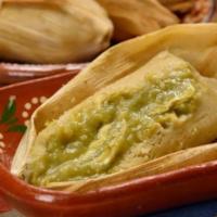 Tamales (1) · A Mexican dish made of cornmeal dough wrapped in a corn husk and steamed filled with  rajas,...