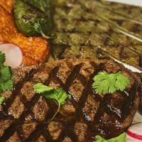 Carne Asada A La Tampiqueña (10 Oz) · Grilled ribeye steak served with rice, beans, grilled cheese, and grilled cactus.