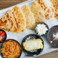 Quesadilla · Two flour tortillas, melted cheese, sides of sour cream, pico de gallo, rice and beans.