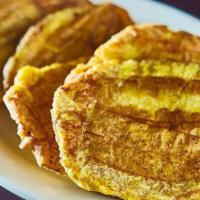 Tostones · Fried Green Plantains.