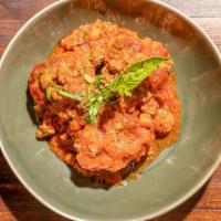 Polpette · Three beef meatballs poached with tomato ragu, fresh basil.
