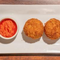 Arancini · Rice balls coated with bread crumbs and fried with various savory fillings.