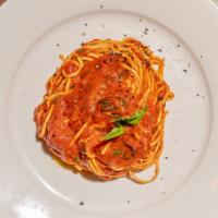 Spaghetti Pomodoro · San Marzano DOP tomatoes cooked simply and gently over hours.