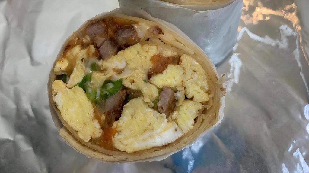 Southwest Breakfast Burrito  · 3 scrambled eggs, sausage, tomatoes, onions,
    cilantro, chili peppers and Swiss cheese