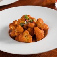 Buffalo Cauliflower Wings · Panko breaded cauliflower, buffalo hot sauce & blue cheese dressing.