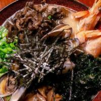 Seafood (Shoyu) Ramen · Dashi & mushroom broth served with thin curly noodles head-on shrimp, manila clams, scallops...