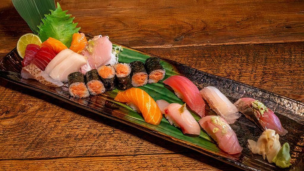 Sushi & Sashimi Combination · Chef choice 10 pieces of sashimi, 5 pieces of sushi & one regular roll.