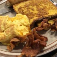 Lumberjack · Two pancakes, two eggs any style, one sausage, two trips of bacon and toast. Turkey Bacon in...