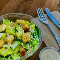 Caesar Salad · Croutons, shaved Parmigiano cheese.