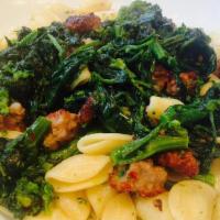 Orecchiette Alla Barese · Hat-shaped pasta with broccoli rabe, sausage, garlic and extra virgin olive oil.