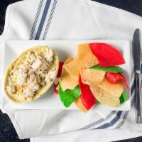Crab-Artichoke Dip · Crab-artichoke spinach dip served with chips.