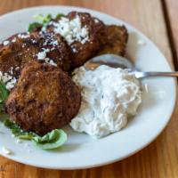 Kolokithokeftedes · Vegetarian. Zucchini fritters with feta cheese and tzatziki.
*The zucchini fritters contain ...