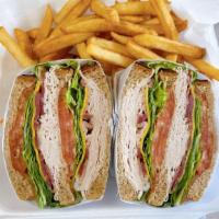 Turkey Club Specialty Sandwich · Turkey, bacon, American cheese, lettuce, tomato, and French fries.