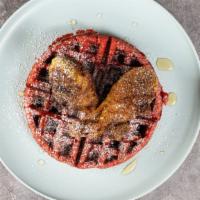 Chicken N Waffles · 2 waffles topped with sweet breaded chicken and powdered sugar