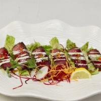Pepper Tuna Tataki · Served with ponzu sauce and scallion.