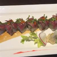 Ocean Grill Special Roll · Shrimp tempura, grilled onions inside topped with beef tataki and chef special sauce.