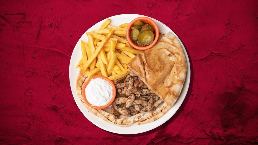 Char Grilled Chicken Plate · Our chicken well marinated in olive oil, garlic seasoning and freshly squeezed lemon juice. It is then charcoaled grilled and then served on a bed of rice with hummus and our freshly baked warm pita.
