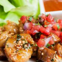 Shrimp Lettuce Wraps · House-made chorizo, peanuts, cilantro, tamarind chutney.
