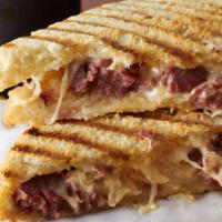 Petersburg Panini · Delicious panini made with slices of roast beef, Jack cheese, roasted peppers, onions, and m...