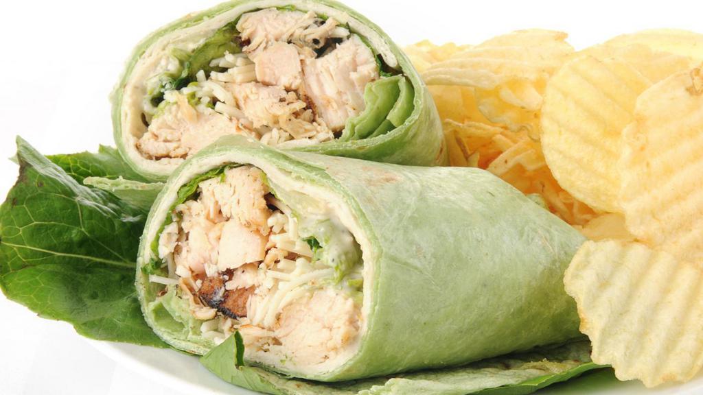 Chicken Caesar Wrap · Tasty wrap made with grilled chicken, romaine lettuce and a Caesar dressing. Served with your choice of macaroni salad, potato salad, or coleslaw.