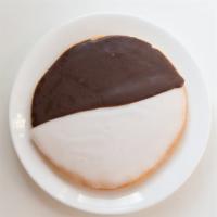 Black And White Cookie · Soft, cakey cookies covered in a thick layer of icing flavored with both vanilla and chocola...