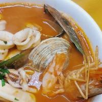 Levanta Muerto  · Seafood soup w/head on shrimp, mussels, clams and calamari in a lightly spiced tomato broth.