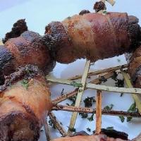 Datiles Rellenos  · Bacon wrapped dates stuffed w/chevre frais