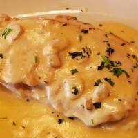 Pollo Al Ajillo · Chicken cutlet in creamy garlic sauce.