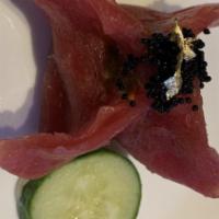 Wasabi Tuna Dumpling · Spicy crab and avocado wrapped by thin-sliced Tuna W. w wasabi mayo sauce.