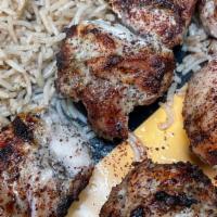 Spiced Chicken Kebab · Served with brown rice, salad and bread.