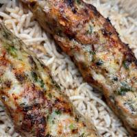 Chicken Kofta Kebab · Served with brown rice, salad and bread.