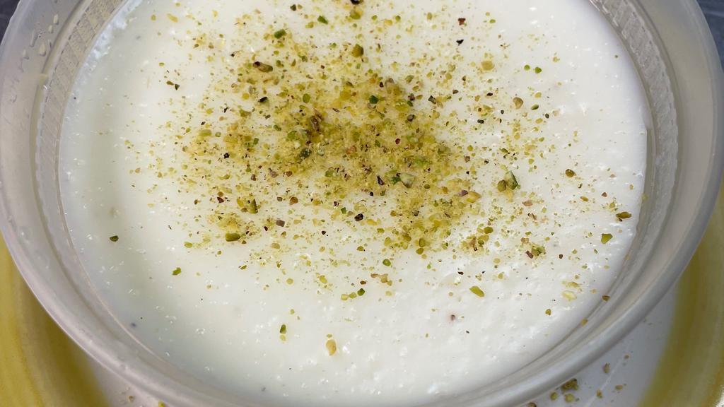Firni · Pudding topped with crushed pistachios.
