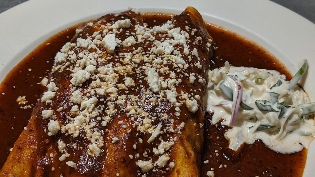 Two Enchiladas · Filled with chicken, Roast pork pibil, beef picadillo or cheese. Suizas, guajillo, house salsa or mole poblano.
Rice and beans.
