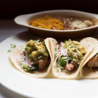 Baja California Fish Tacos · Avocado and cilantro salsa, rice and beans.