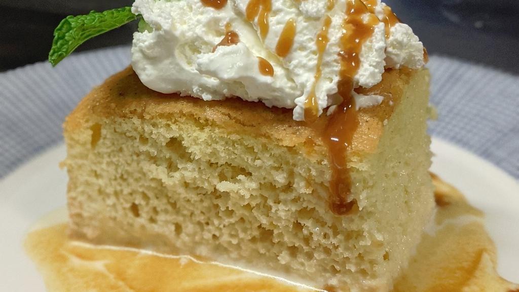 Tres Leches Cake · Traditional party cake with three milks. Rum-caramel sauce.
