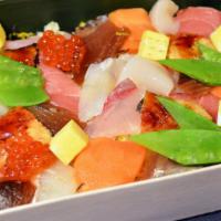 Bara Chirashi · variety of seafood with some vegetables and pickles over the sushi rice