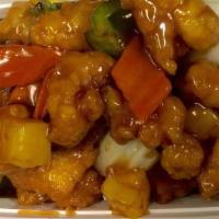 Pineapple Chicken 菠萝鸡 · White meat chicken fried golden-brown and served with green peppers and Chinese vegetables i...