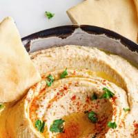 Hummus · Chickpeas mashed into a paste with lemon juice and flavored with tahini.